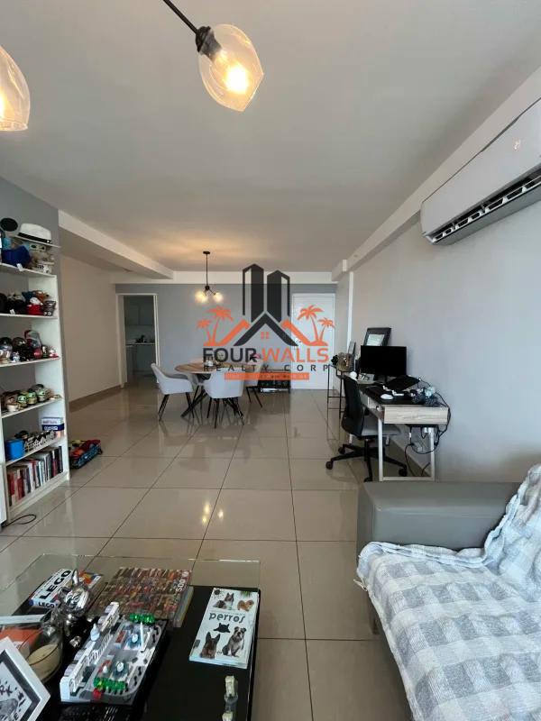 Contemporary kitchen with white cabinetry, built-in appliances, window and granite-style counters in San Francisco Panama