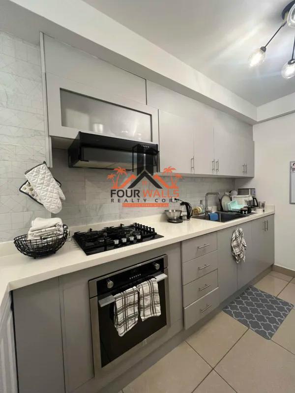Contemporary bathroom with beige tile, glass shower and vanity sink in PH San Francisco Bay Panama City