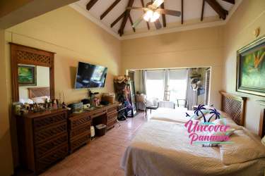 Covered patio terrace with garden, pool, and golf course views Costa Blanca Golf Panama