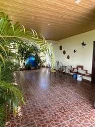 Traditional kitchen granite counters, microwave & fridge in family house for sale in La Chorrera