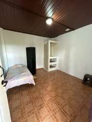 Single-story home with carport and lush landscaping in La Chorrera for sale