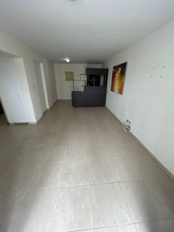 Bright living dining space with tile flooring, access to balcony in PH Villa de las Fuentes Panama City