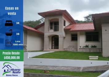 Modern open-plan living room and dining with large windows and staircase in Las Villas Volcán