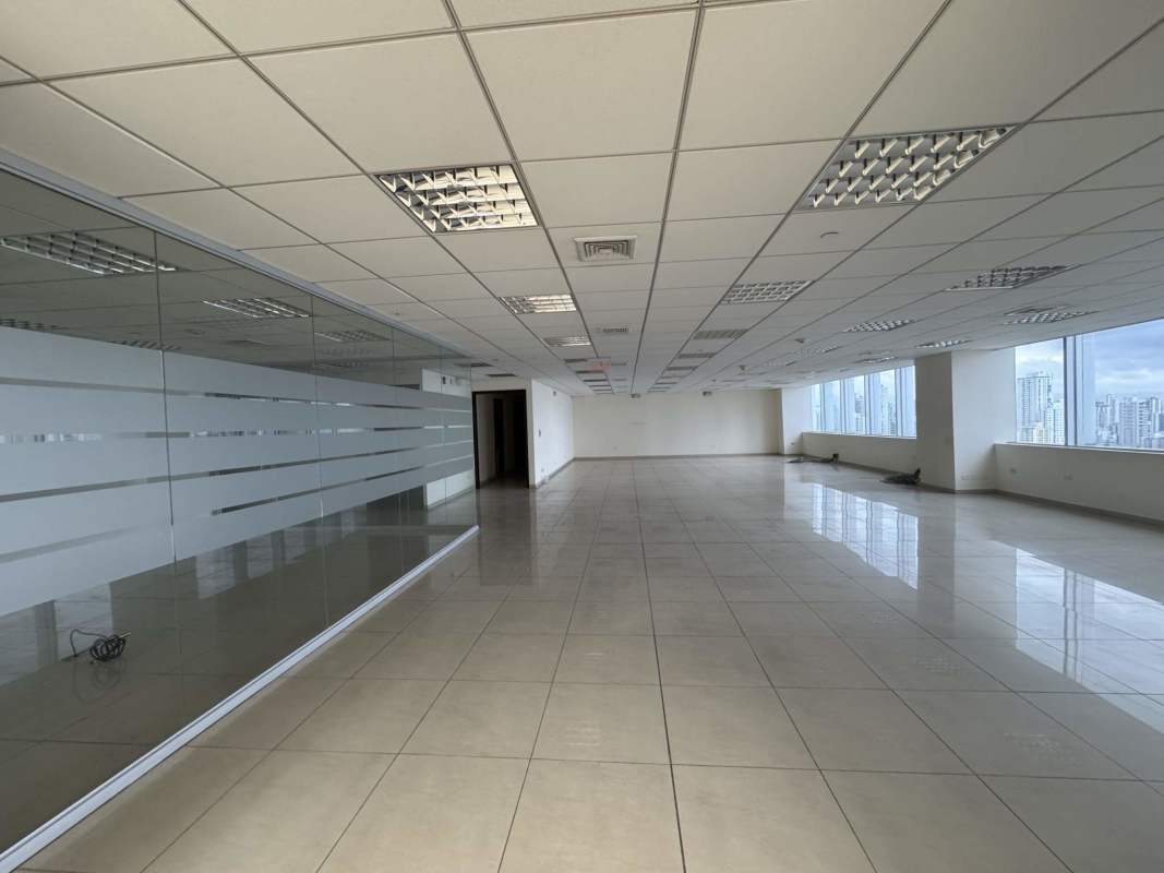 Open plan office with glass walls, natural light and tiled floors in Punta Pacífica Ocean Business Plaza Panama City