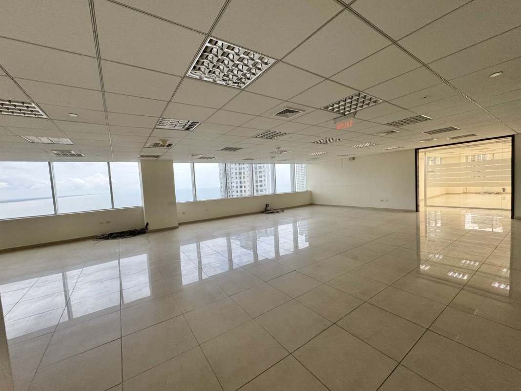 Spacious empty office with large windows offering city skyline and ocean views in Panama City Punta Pacífica