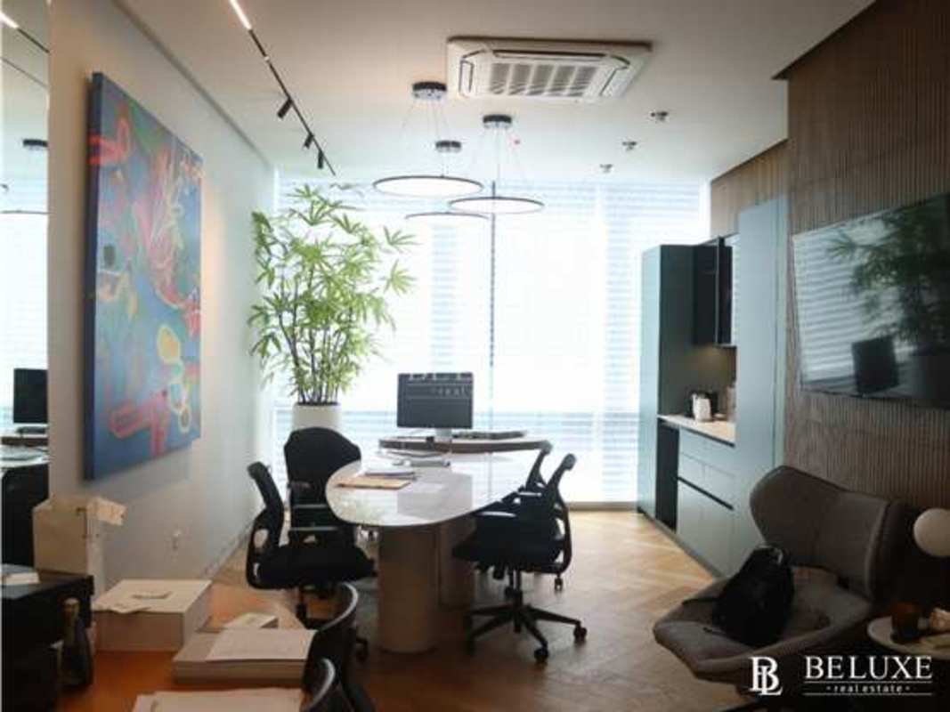 Glass walled private office with large windows panoramic cityscape Santa Maria Panama