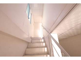 Backyard garden with tropical vegetation and patio space in rural house Coclé Panama