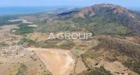 Aerial photo of large flat land area near mountains and coastline ideal for development in Chame Panama