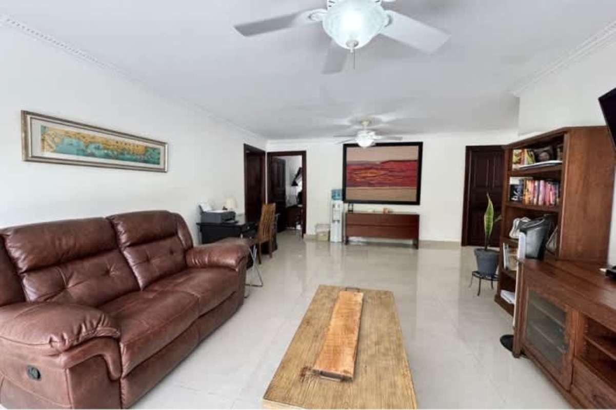 Modern bedroom with tile floor and terrace access Altos del Golf house Panama