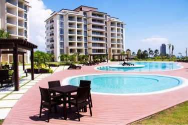 View of Casamar Resort swimming pool tropical landscaping beachfront San Carlos Panama