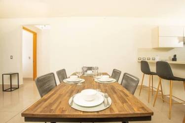 Elegant dining area with large glass windows ocean views at Perlamar Casamar Resort San Carlos Panama