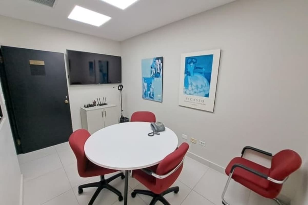 Conference room with round table and TV for presentations PH Banco General Tower Panama City