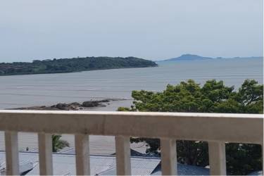 Balcony with panoramic views of Pacific Ocean and natural landscape from Playa Dorada condo Panama