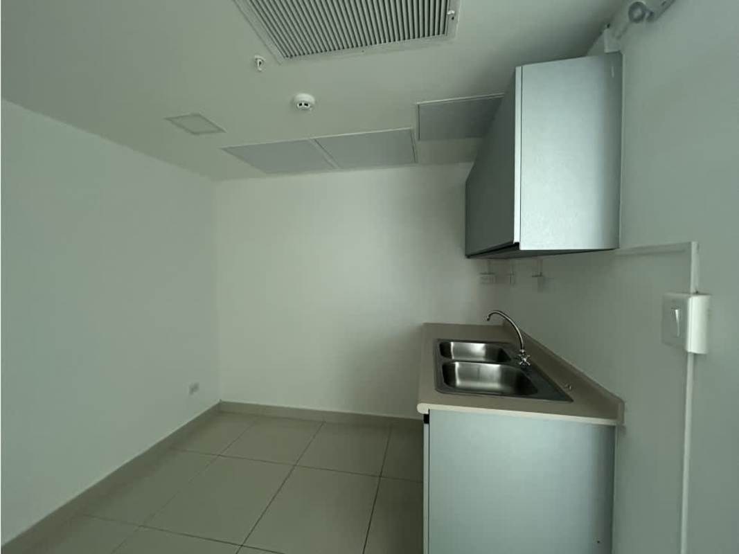 Minimalist kitchenette area with dual sink in commercial office Costa del Este Panama