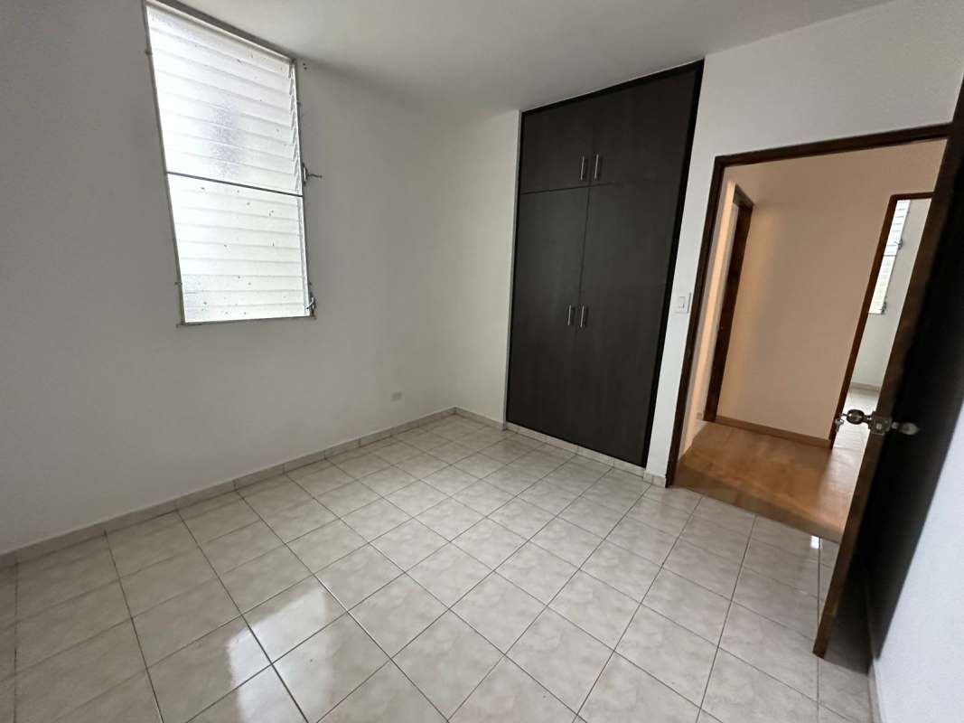 Second bedroom with large window and wardrobe space Panama City apartment