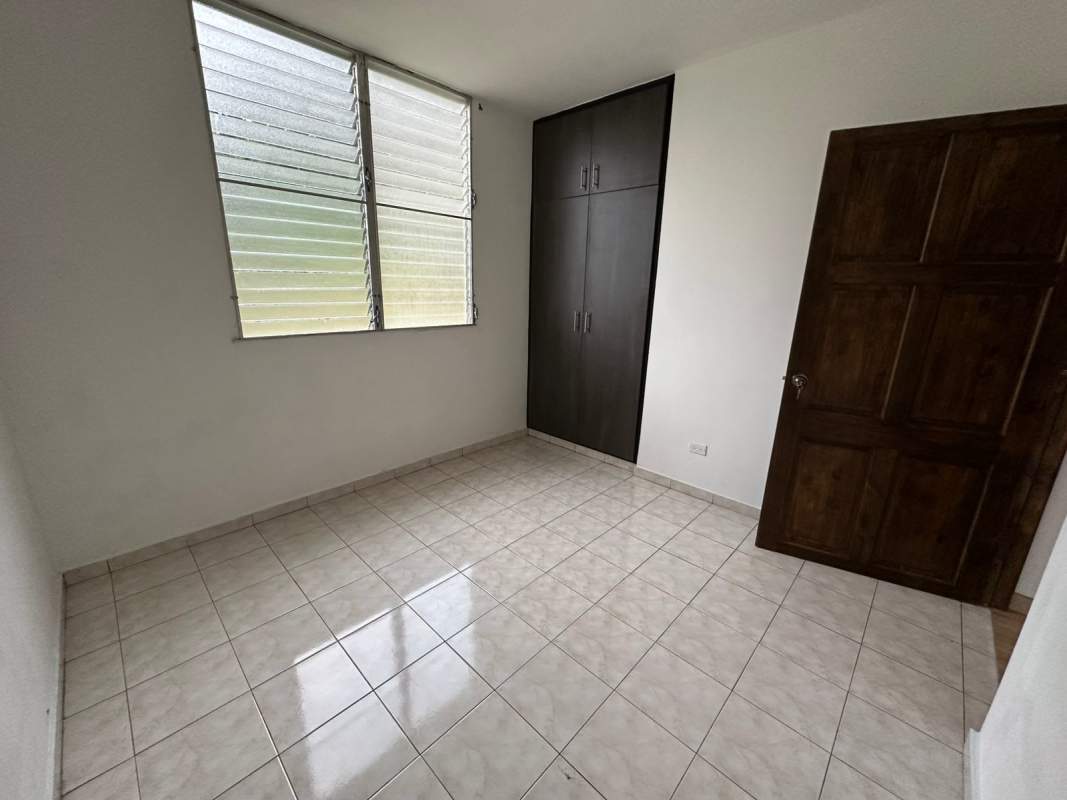 Bright living room with large window in Condado del Rey Panama apartment for sale