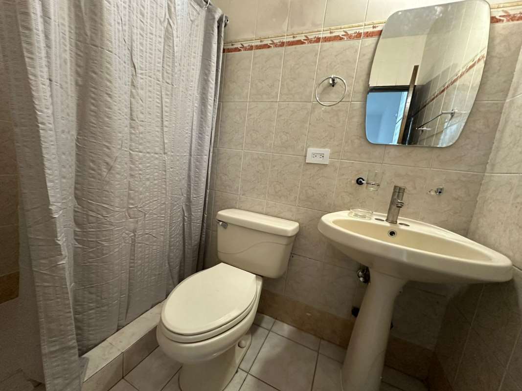 Bedroom with ceiling fan, closet space, and tiled floors PH Las Roccas Panama