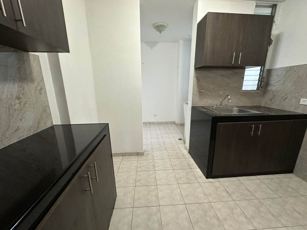 Minimalist bedroom with built-in closet and large window at PH Las Roccas Condado del Rey