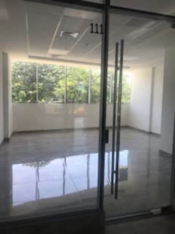 Aerial city view showing Sunset Strip office plaza in Panama City business hub