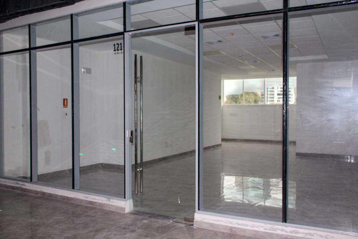 Modern commercial retail-office space with full glass storefront in Sunset Strip Plaza Panama City