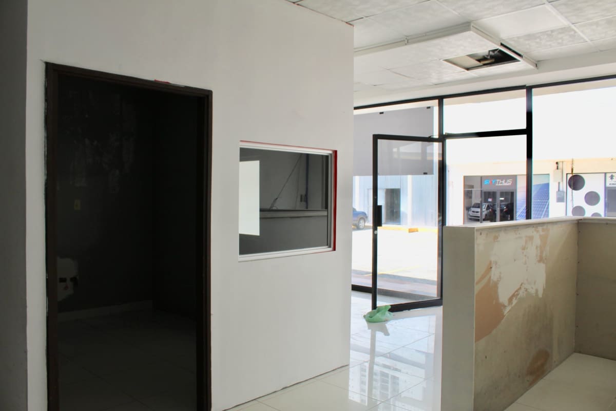 Reception lobby with glass wall and tiled floor in commercial unit at Display Plaza San Miguelito Panama City