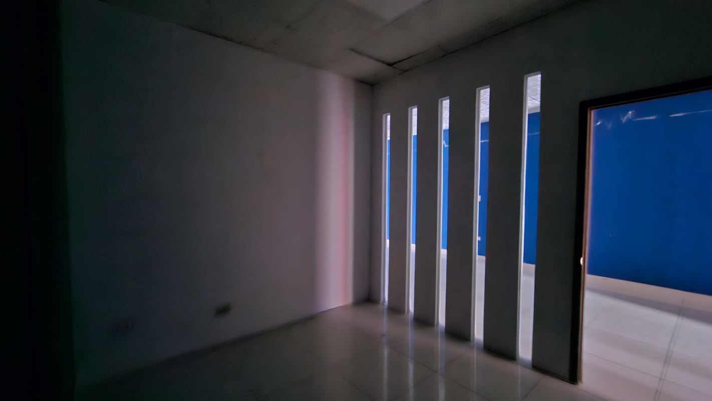 Modern unfurnished commercial interior with partition wall and tiled floors at Display Plaza Panama City