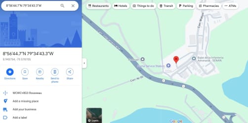 Large paved open commercial lot with surrounding forested area under blue sky in Rodman La Chorrera Panama