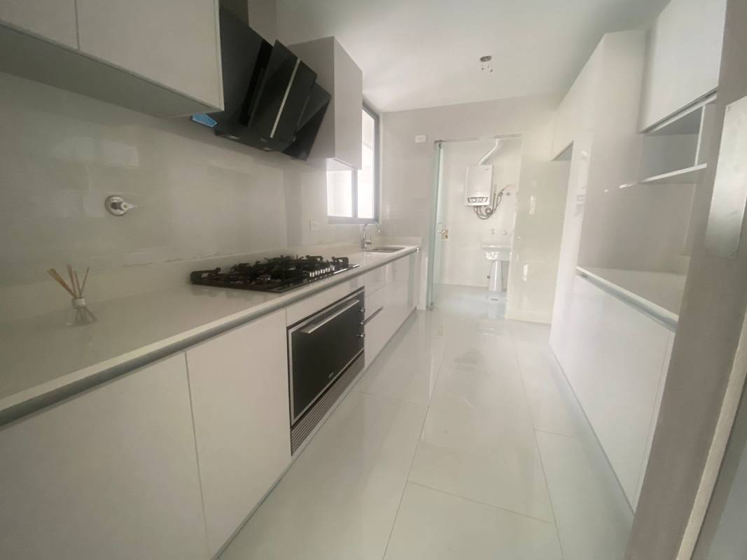 Covered poolside lounge with modern seating overlooking swimming pool at PH Velure El Cangrejo Panama City