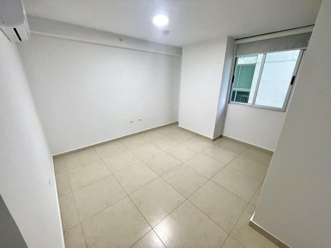 Bright modern bedroom with AC, tile floors, large window in PH Santa Maria Court Panama