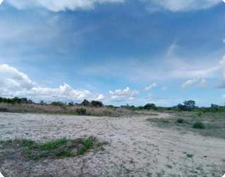 Open plot of land with sparse vegetation partly cloudy sky Penonomé Coclé