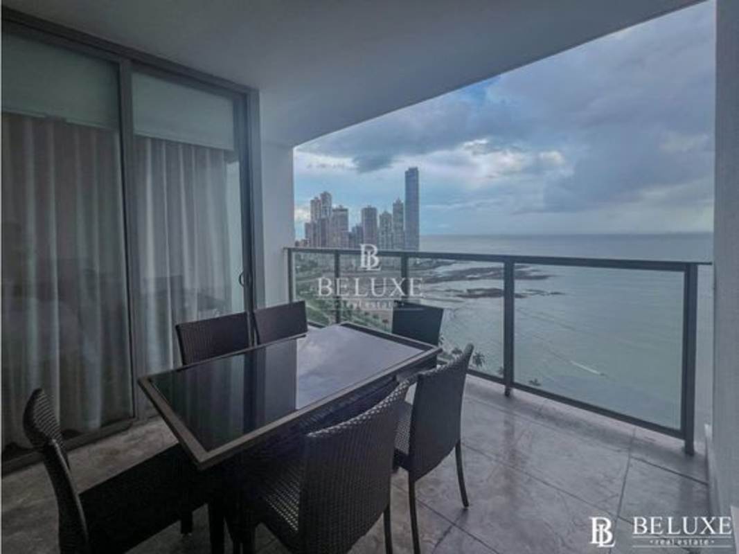 Balcony with glass railing overlooking ocean and Panama skyline at PH Yoo Panama