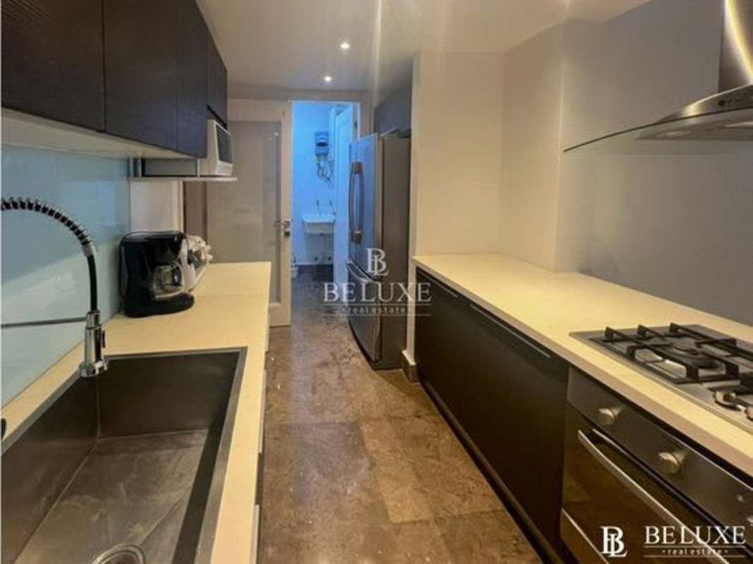 Walk-in closet with built-in shelves, mirror in luxury apartment PH Yoo Panama