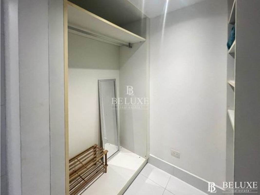 Minimalist walk-in closet in PH Yoo Panama apartment