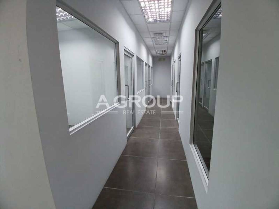 Reception lobby with desk, glass doors, and tiled floors Edificio ELMEC San Francisco Panama