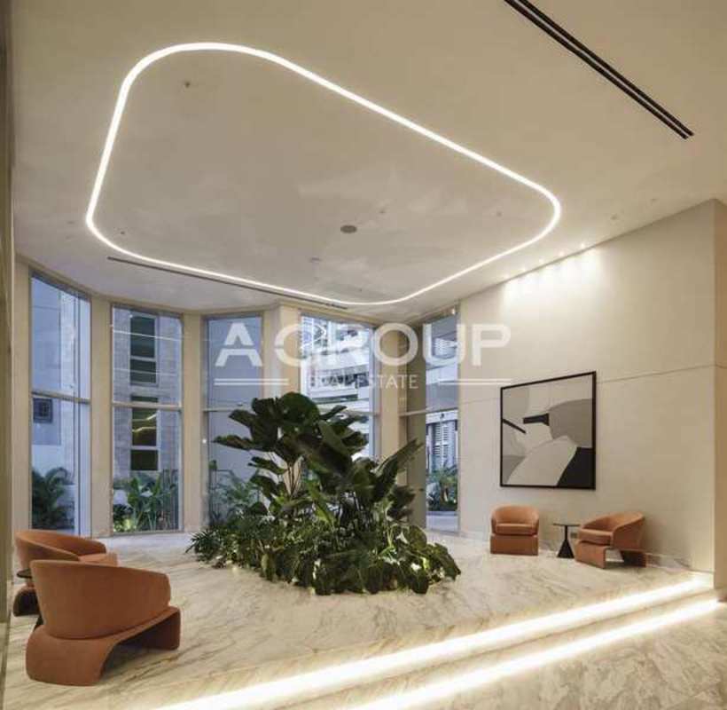 Contemporary lobby with marble reception and stylish seating at Pacific Point Tower 400 Panama City