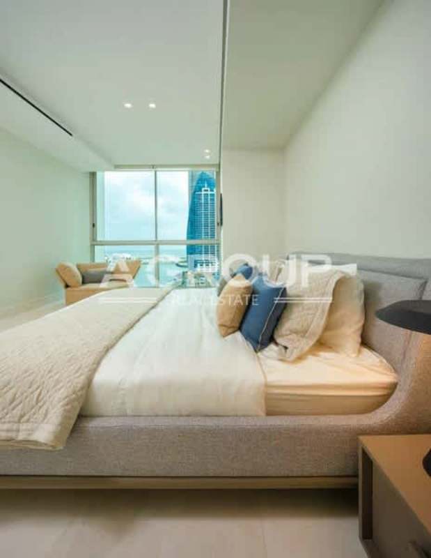 Large master bedroom with panoramic ocean-facing windows in Pacific Point Tower 400 Panama