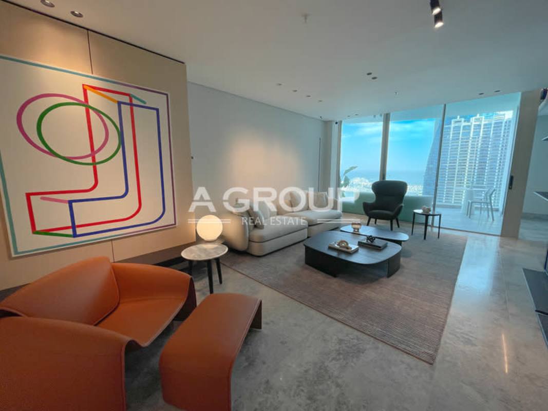 Luxury condo living room with city and water views at Pacific Point Tower 400 Panama City