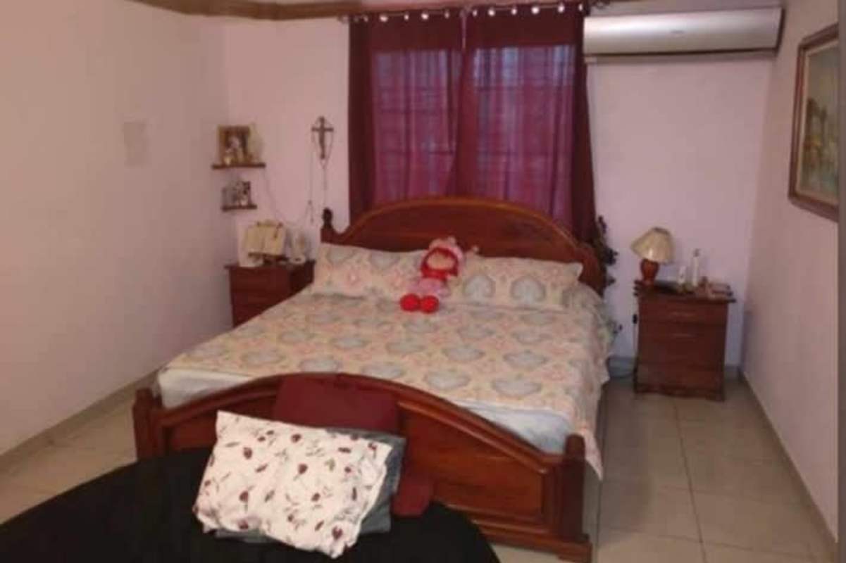 Traditional staircase with storage and glass cabinet in Cerro Viento home for sale