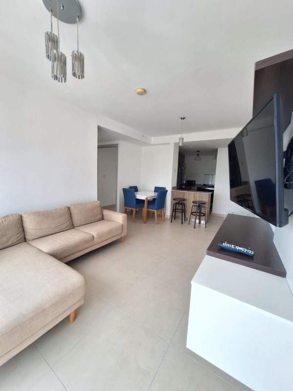 Modern kitchen with granite counters, refrigerator and stove at PH Riverwalk El Crisol Panama City