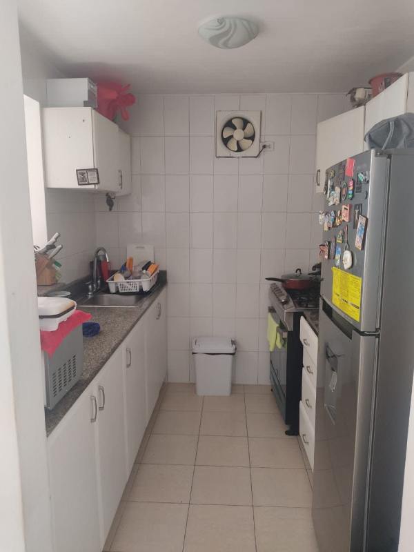 Bright living and dining area with floor-to-ceiling windows, balcony access in Edison Park apartment