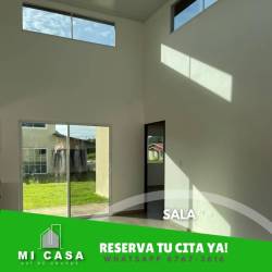Bright living room with large windows and garden view in Residencial Reserva Santiago Veraguas house for rent