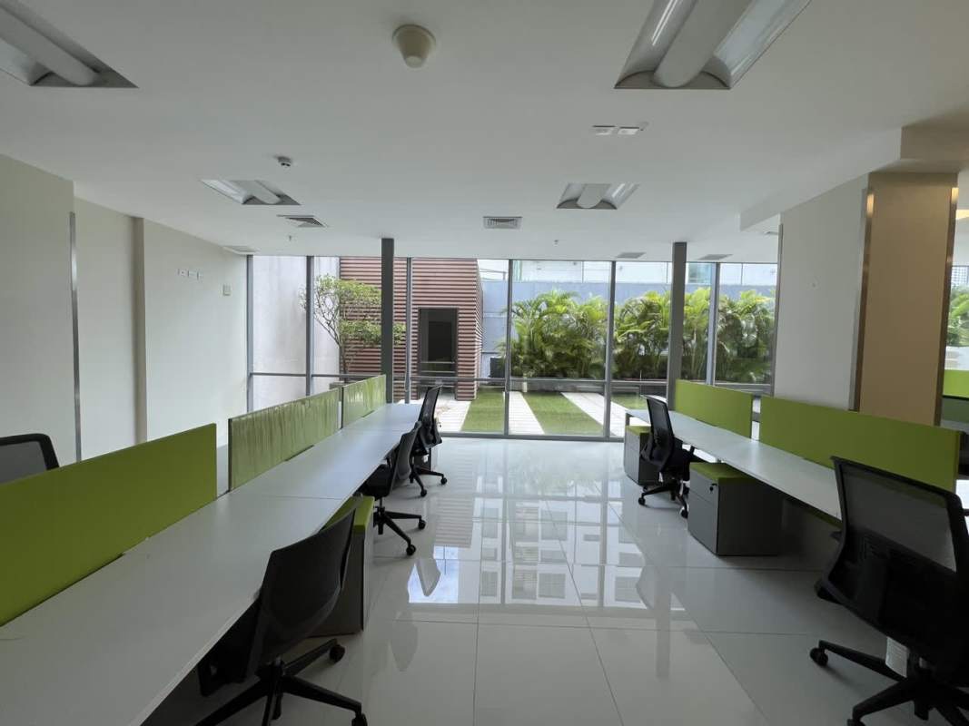 Bright corporate office with glass windows and open desks for rent at Costa del Este Panama