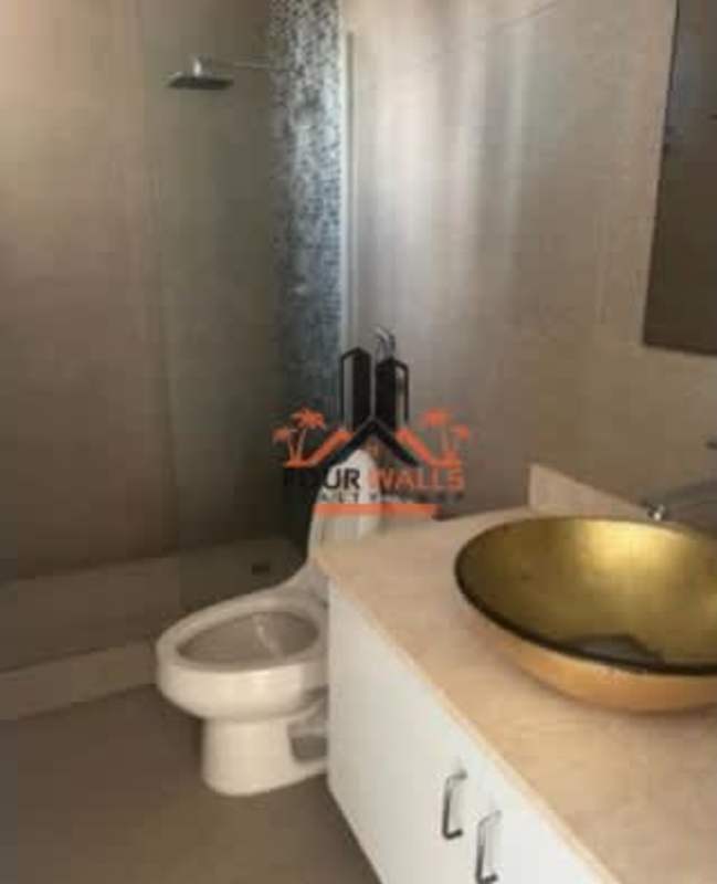 Modern kitchen with white cabinets, black counters PH Marfil Obarrio Panama