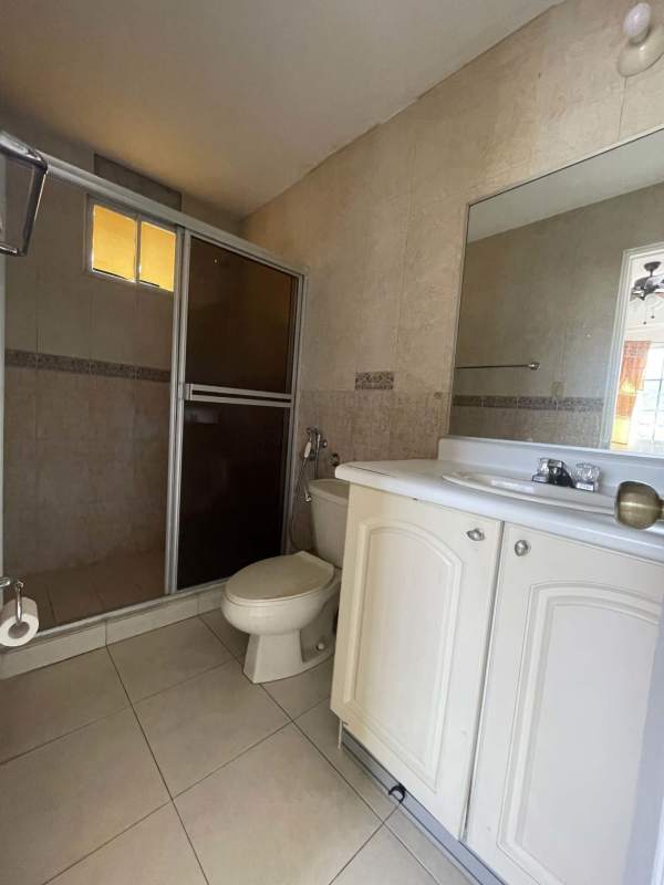 Modern living room tile floors ceiling fan large windows Dorado Lake Condado del Rey Panama