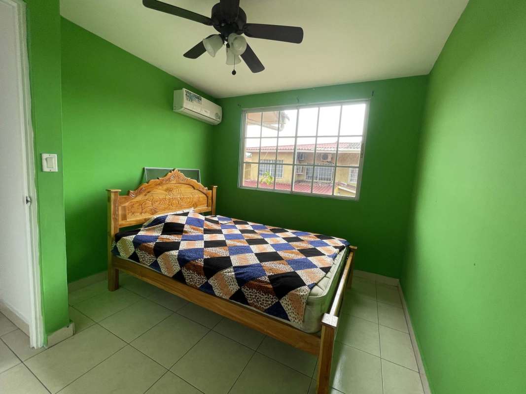 Two-story Mediterranean style house terracotta roof carport Dorado Lake Panama City