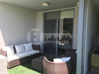 Private covered terrace with outdoor furniture at PH Mosaic Panama Pacifico apartment