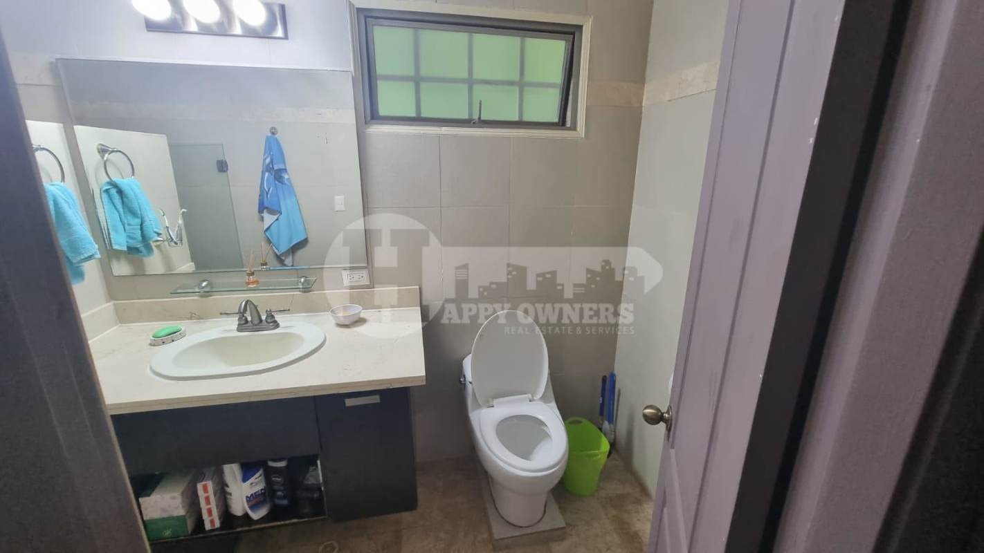 Master bedroom with large window and ocean city views in Causeway Tower Amador Panama