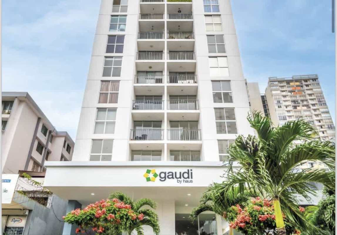 Modern facade of PH Gaudi high-rise featuring balconies and tropical landscaping