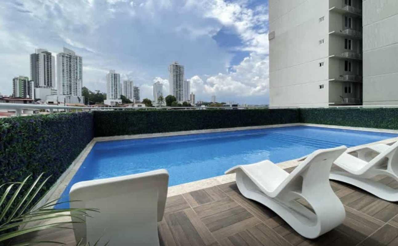 Spacious modern living room with large windows and stylish décor in PH Gaudi Panama City