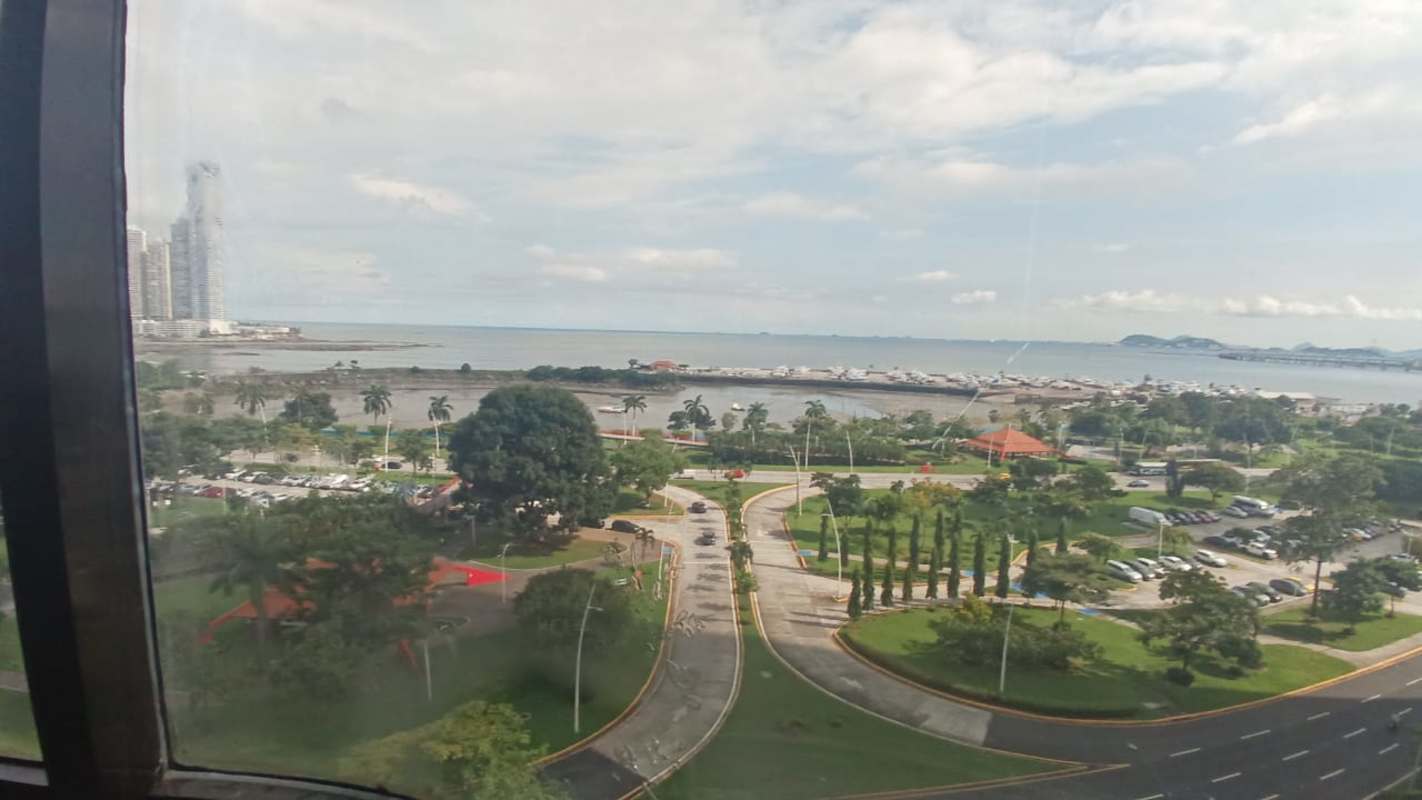 Office balcony with marble floors glass walls panoramic ocean and skyline views PH BICSA Avenida Balboa Panama